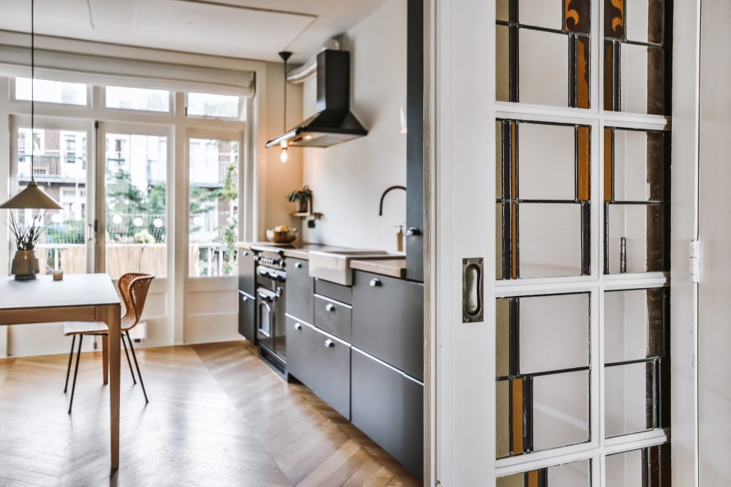 interior shot modern kitchen with decorations furniture entrance